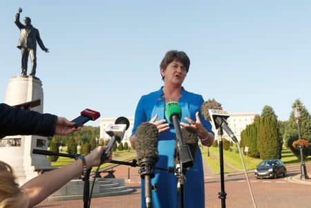 Arlene Foster of the Democratic Unionist Party speaks to the media as she arrives at parliament buildings on the Stormont estate, in Belfast, September 8, 2015. REUTERS/Cathal McNaughton