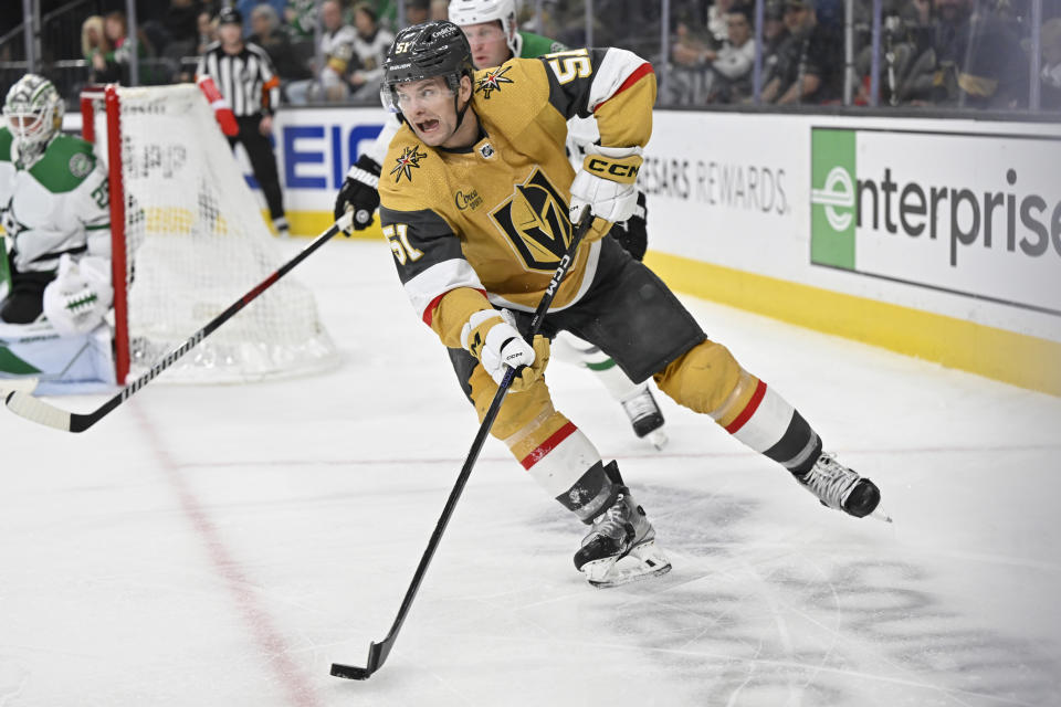 Vegas Golden Knights center Byron Froese (51) skates with the puck against the Dallas Stars during the second period of an NHL hockey game Saturday, Feb. 25, 2023, in Las Vegas. (AP Photo/David Becker)