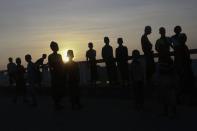 Rohingya boys enjoy the sunrise in Maungdaw town in northern Rakhine State November 10, 2014. REUTERS/Minzayar