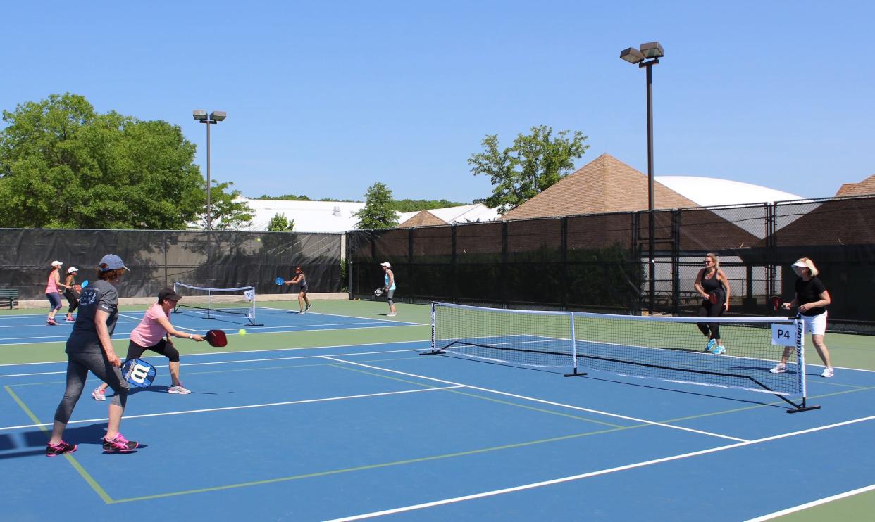 Seniors enjoy an outdoor game of pickleball at The Atlantic Club in Wall.