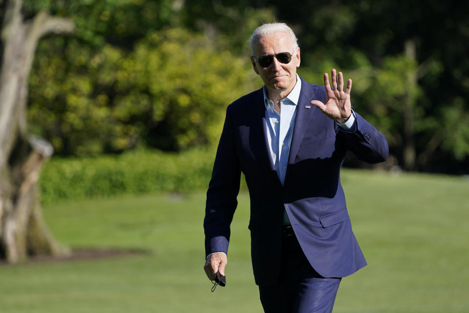 President Joe Biden waves as he walks on the South Lawn of the White House in Washington, Tuesday, June 29, 2021, after returning from a trip to Wisconsin. (AP Photo/Susan Walsh)