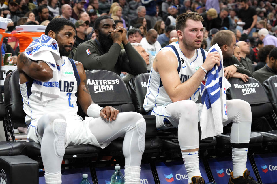 Feb 11, 2023; Sacramento, California, USA; Dallas Mavericks guard Kyrie Irving (2) and guard Luka Doncic (right) sit on the bench during the third quarter against the Sacramento Kings at Golden 1 Center. Mandatory Credit: Darren Yamashita-USA TODAY Sports