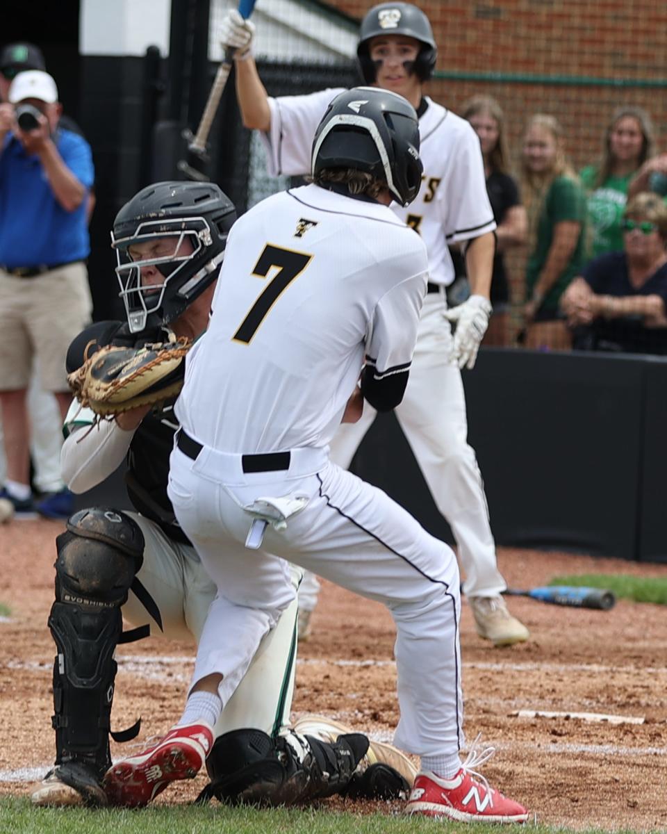 Taylor base runner Mark Snowden is tagged out at the plate by Badin catcher Jimmy Nugent in the game between Badin and Taylor high schools at Mason High School, June 2, 2022. Nugent is the 2022 Ohio high school winner of the Johnny Bench Award.