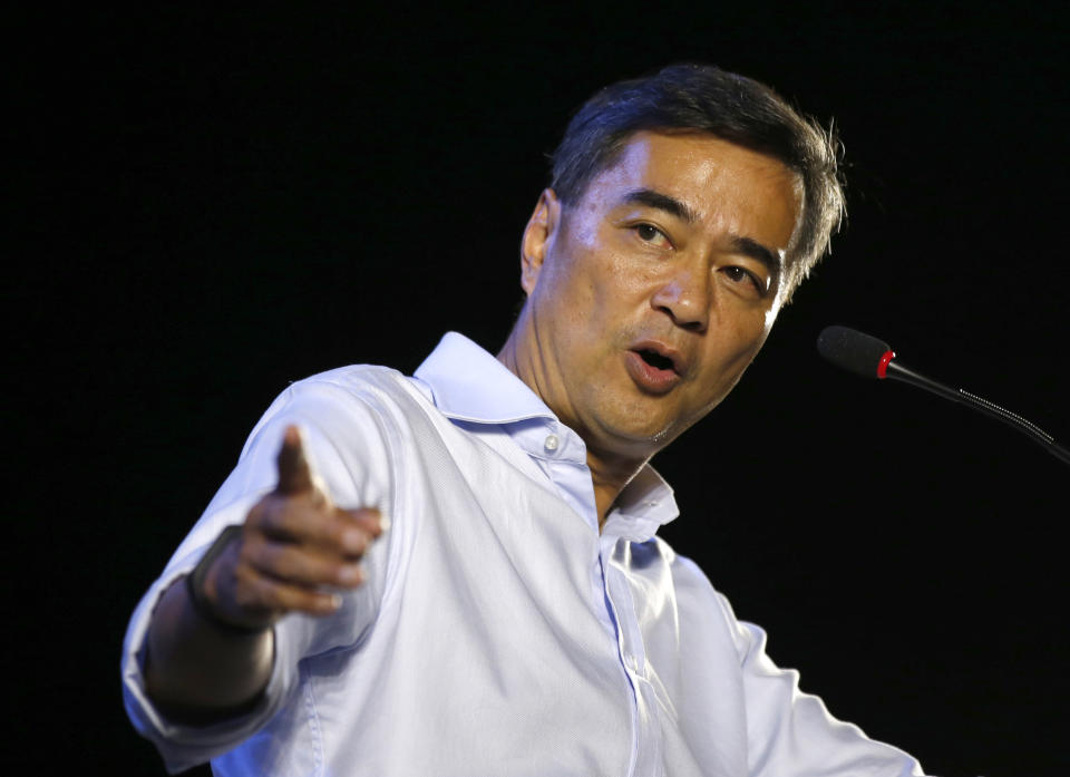 In this Monday, March 18, 2019, photo, the leader of Thailand's Democrat Party Abhisit Vejjajiva delivers a speech to supporters during an election campaign in Bangkok, Thailand, Abhisit says if he becomes prime minister after Sunday’s election, he’ll make careful but forceful efforts to undo undemocratic constitutional clauses imposed by the military government that took power in 2014. (AP Photo/Sakchai Lalit)