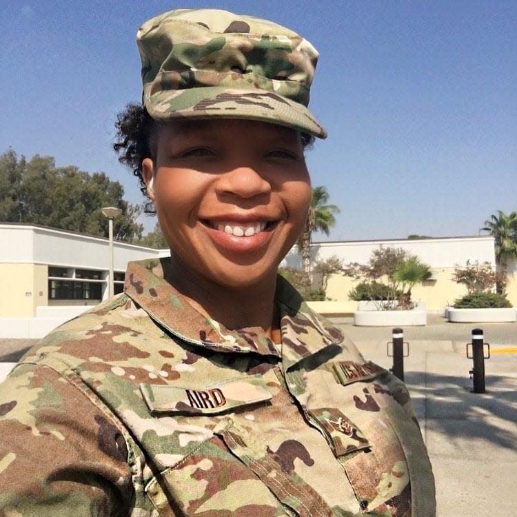 “You really don’t even realize the roles you take on,” Dwinese Aird said, explaining how she helped look out for the younger members of her unit while deployed.