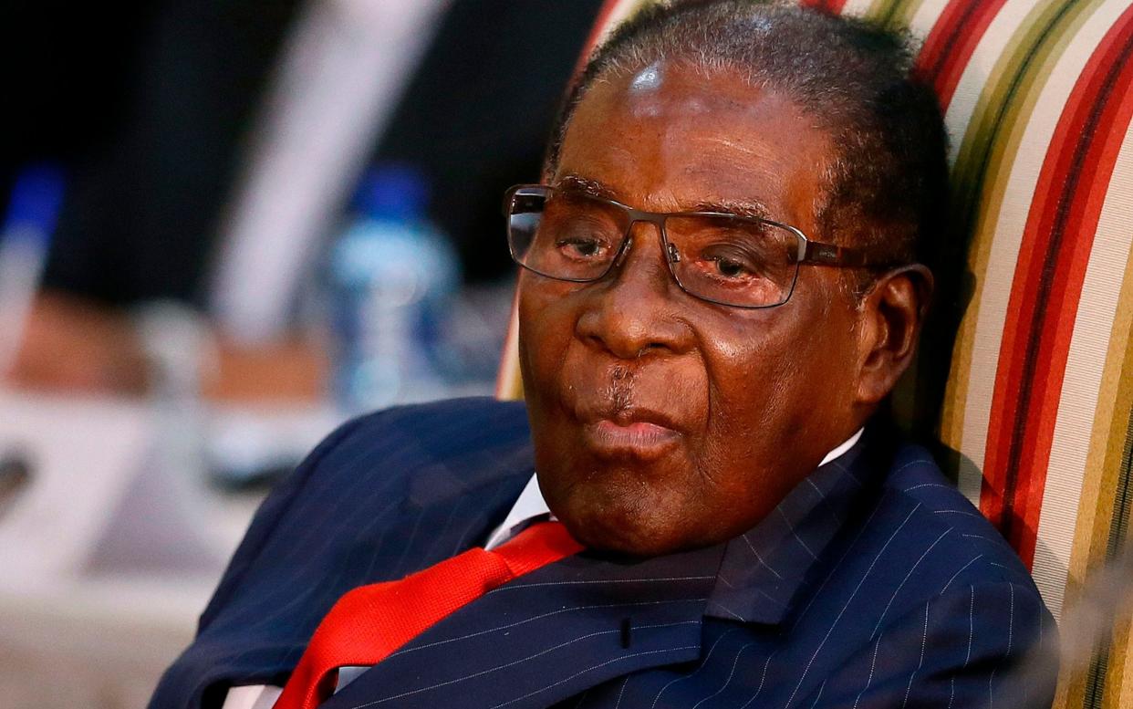 President Robert Mugabe's savage rule over Zimbabwe was dominated by murder, bloodshed, torture and intimidation on a grand scale - AFP