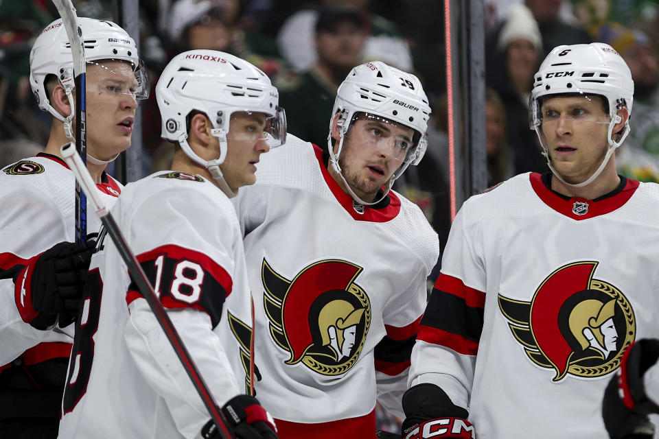 Ottawa Senators right wing Drake Batherson, second from the right, is congratulated for his goal by teammates during the second period of an NHL hockey game against the Minnesota Wild Tuesday, April 2, 2024, in St. Paul, Minn. (AP Photo/Matt Krohn)