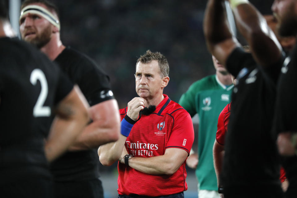 Referee Nigel Owens gestures during the Rugby World Cup quarterfinal match at Tokyo Stadium between New Zealand and Ireland in Tokyo, Japan, Saturday, Oct. 19, 2019. (AP Photo/Eugene Hoshiko)