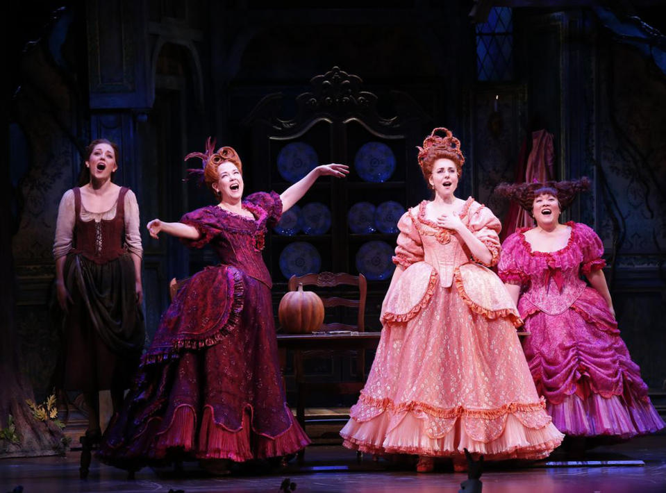 This theater image released by Sam Rudy Media Relations shows, from left, Laura Osnes as Cinderella, Harriet Harris as Cinderella's stepmother; Marla Mindelle as stepsister Gabrielle and Ann Harada as stepsister Charlotte. during a performance of "Rodgers + Hammerstein's Cinderella on Broadway." (AP Photo/Sam Rudy Media Relations, Carol Rosegg)