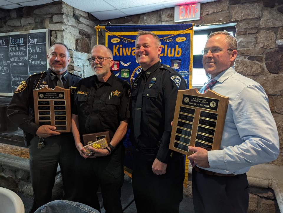 Ottawa County Sheriff Stephen Levorchick, left, stands with Dep. Phil Langhals, Officer Curt Cochran, and Port Clinton Police Chief David Scott, at the Port Clinton Kiwanis Law Enforcement Awards ceremony on Wednesday.