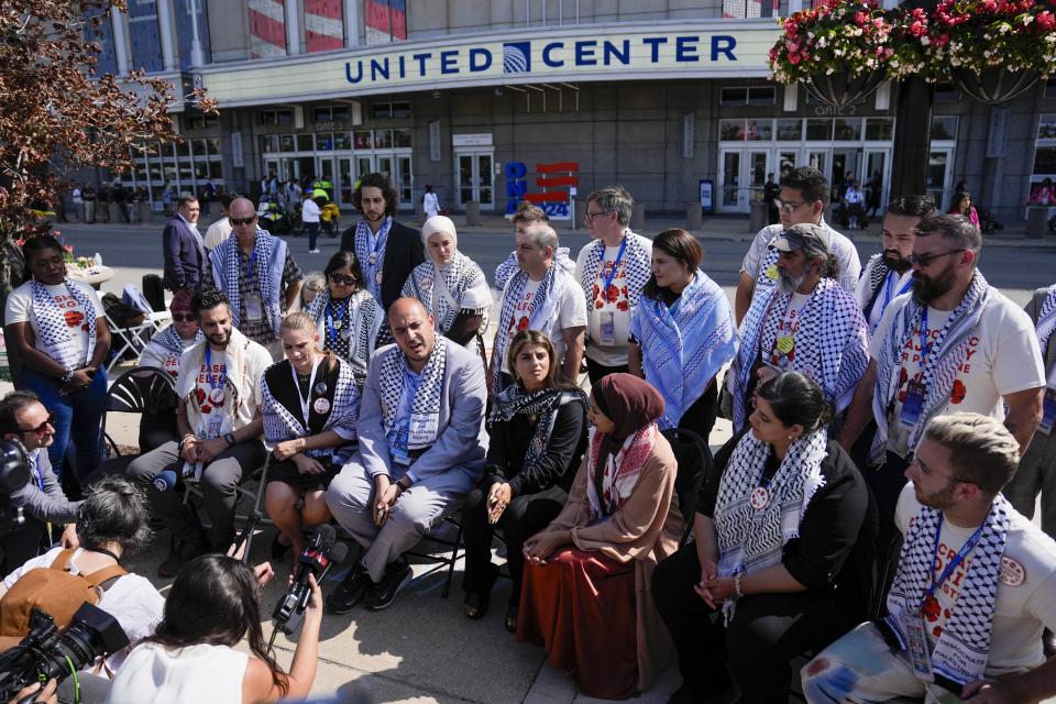 Uncommitted delegates hold a press conference outside the United Center before the Democratic National Convention Thursday, Aug. 22, 2024, in Chicago. (AP Photo/Matt Rourke)