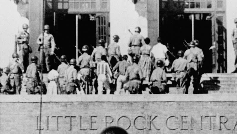 In this Sept. 25, 1957, file photo, nine African American students enter Central High School in Little Rock, Ark., escorted by troops of the 101st Airborne Division.