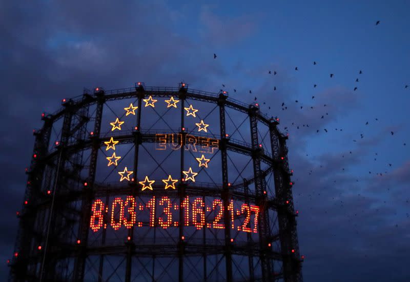 FILE PHOTO: Young activists install giant "carbon clock" at former gasometer in Berlin