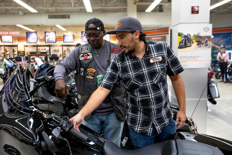 Veteran Prince Grant speaks with a sales associate while he browses for bikes after he rode his motorcycle from Marathon to Peterson’s Harley-Davidson South as part of a Wounded Warrior Project mental health program, “Rolling Project Odyssey”, in Cutler Bay, Florida, on Tuesday, October 12, 2021. The group stopped at the Harley-Davidson dealer to get a tour of the facilities.