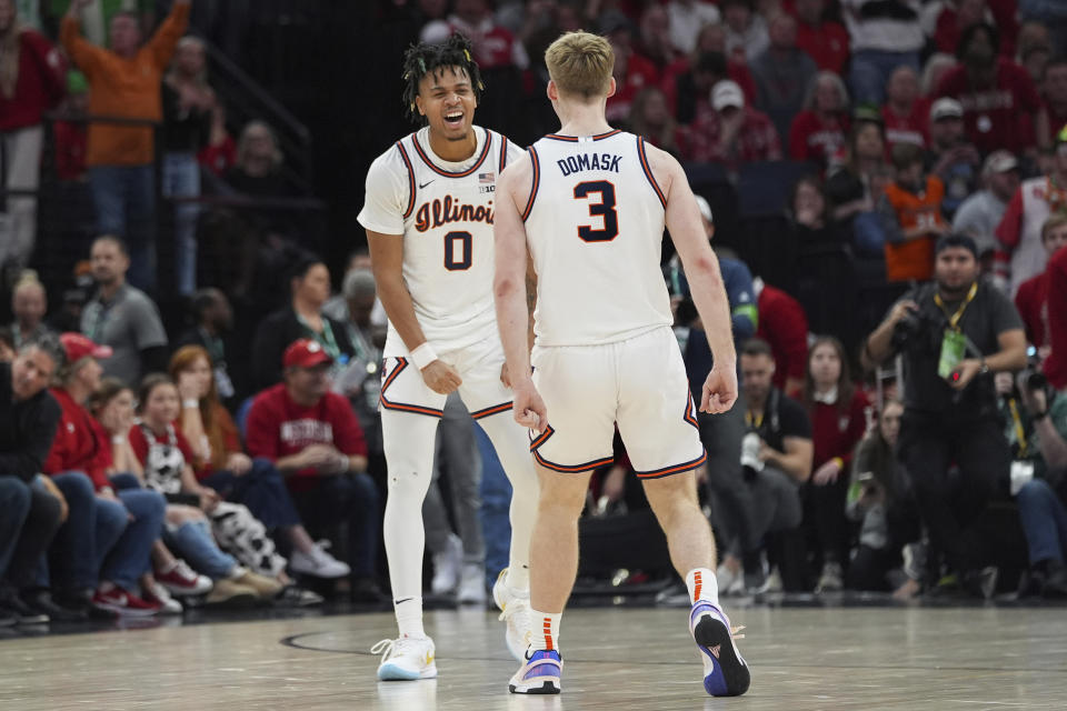 Illinois guard Terrence Shannon Jr. (0) celebrates toward forward Marcus Domask (3) as time expires in their victory over Wisconsin of an NCAA college basketball game in the championship of the Big Ten Conference tournament, Sunday, March 17, 2024, in Minneapolis. (AP Photo/Abbie Parr)