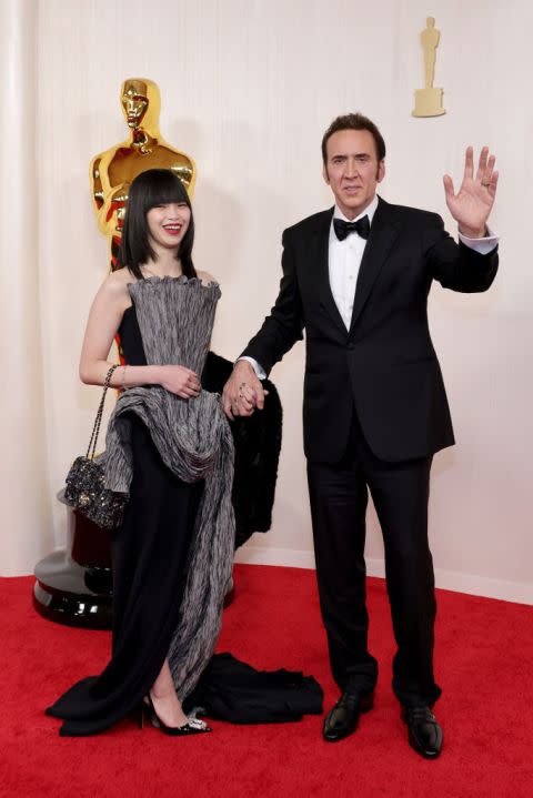 HOLLYWOOD, CALIFORNIA – MARCH 10: (L-R) Riko Shibata and Nicolas Cage attend the 96th Annual Academy Awards on March 10, 2024 in Hollywood, California. (Photo by Aliah Anderson/Getty Images)