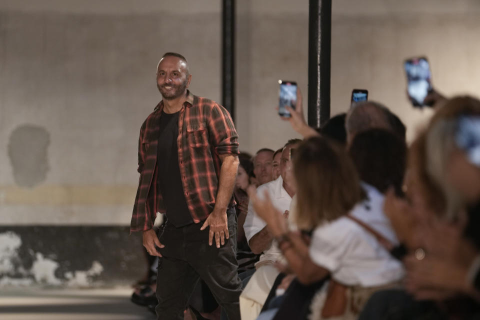 Fashion designer Alessandro Dell'Acqua acknowledges spectators the end of the presentation of his N21 women's Spring Summer 2024 collection, in Milan, Italy, Wednesday, Sept. 20, 2023. (AP Photo/Luca Bruno)