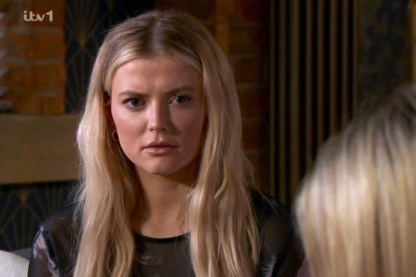 Bethany is suspicious of Joel -Credit:ITV