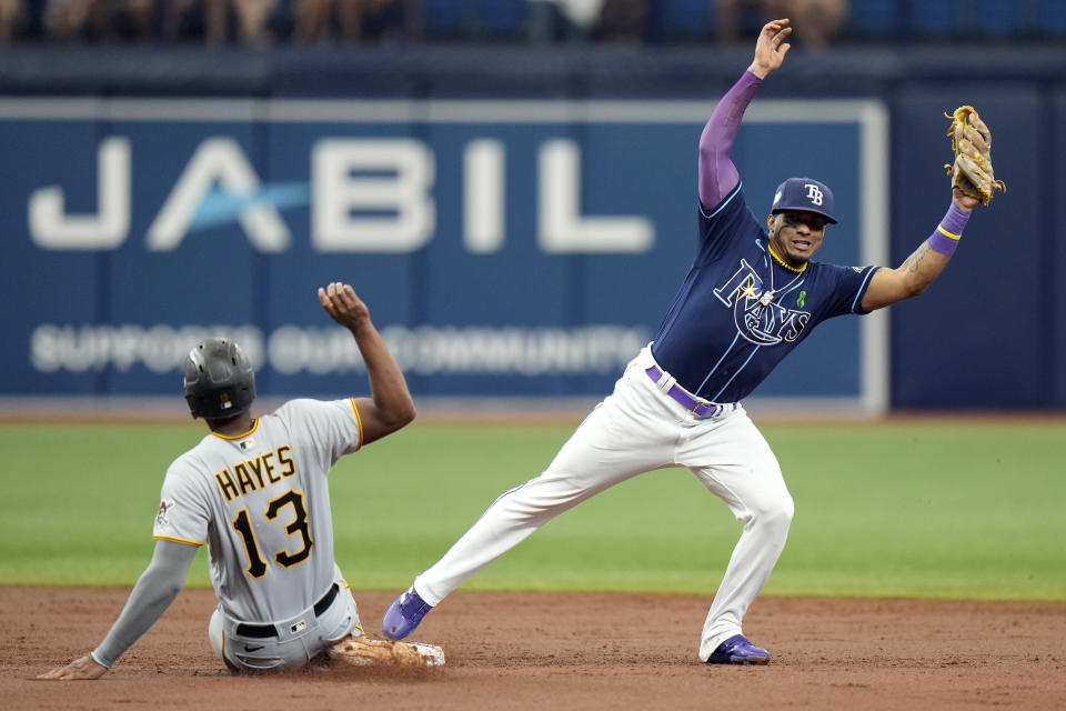 Tampa Bay Rays shortstop Wander Franco forces Pittsburgh Pirates' Ke'Bryan Hayes (13) at second base on a fielder's choice by Ji Hwan Bae during the third inning of a baseball game Thursday, May 4, 2023, in St. Petersburg, Fla. (AP Photo/Chris O'Meara)