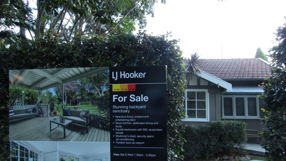 Australian house for sale with sign out front