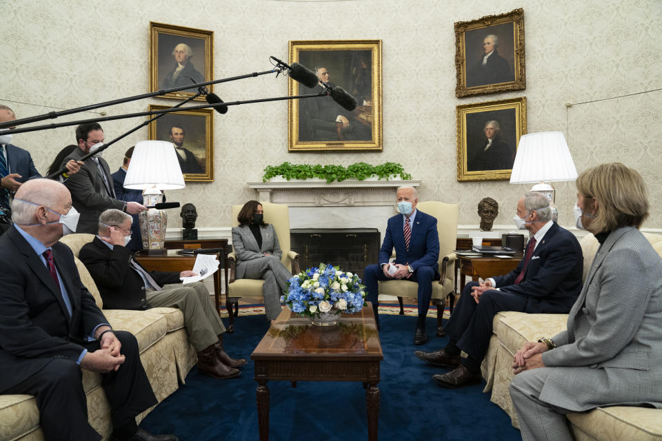 President Joe Biden speaks during a meeting with lawmakers on investments in infrastructure, in the Oval Office of the White House, Thursday, Feb. 11, 2021, in Washington. From left, Sen. Ben Cardin, D-Md., Sen. Jim Inhofe, R-Okla., Vice President Kamala Harris, Biden, Sen. Tom Carper, D-Del., and Sen. Shelley Moore Capito, R-W.Va. (AP Photo/Evan Vucci)