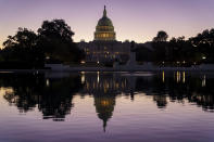 FILE - In this Sept. 27, 2021, file photo the Capitol is seen at dawn in Washington. Divided Democrats struggling to enact President Joe Biden’s domestic agenda are confronting one of Congress’ cruelest conundrums — your goals may be popular, but that doesn't ensure they'll become law or that voters will reward you. (AP Photo/J. Scott Applewhite, File)