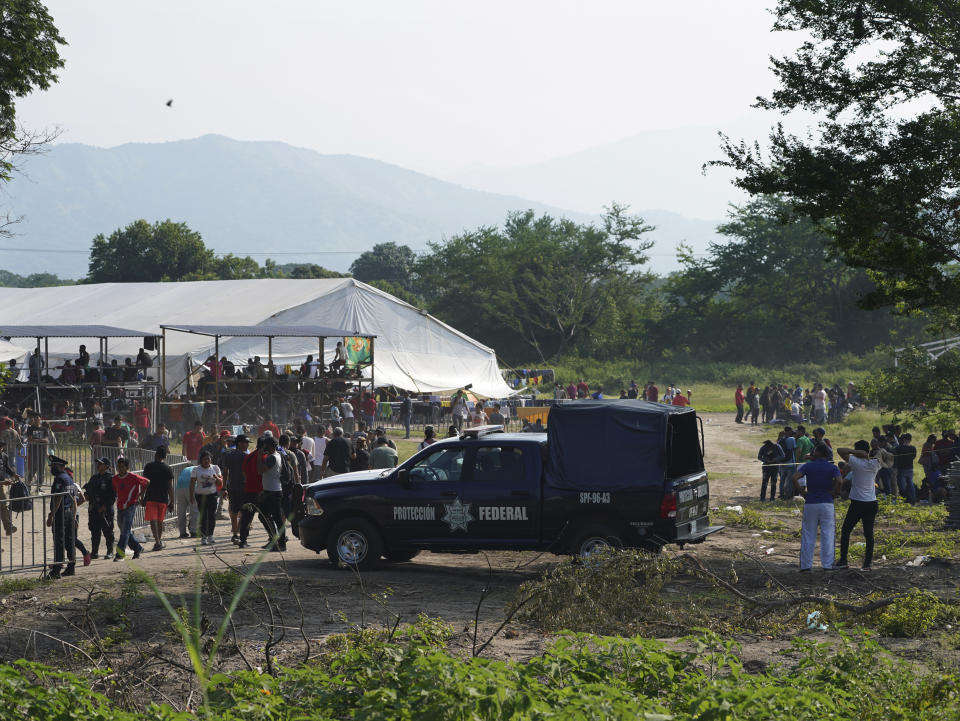 Migrants, mostly from Venezuela, arrive at a camp where Mexican authorities will arrange permits for their continued travel north, in San Pedro Tapanatepec, Oaxaca, Mexico Wednesday, Oct. 5, 2022. As migrants, especially Venezuelans, struggle to come to terms with a new U.S. policy discouraging border crossings, the town of San Pedro Tapanatepec is unexpectedly playing host to over 10,000 migrants camped far from the U.S. border. (AP Photo/Marco Ugarte)