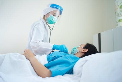 <span class="caption">Physiotherapists can help improve a patient's breathing.</span> <span class="attribution"><a class="link " href="https://www.shutterstock.com/image-photo/doctor-wearing-ppe-suit-surgical-mask-1691900056" rel="nofollow noopener" target="_blank" data-ylk="slk:theskaman306/ Shutterstock;elm:context_link;itc:0;sec:content-canvas">theskaman306/ Shutterstock</a></span>