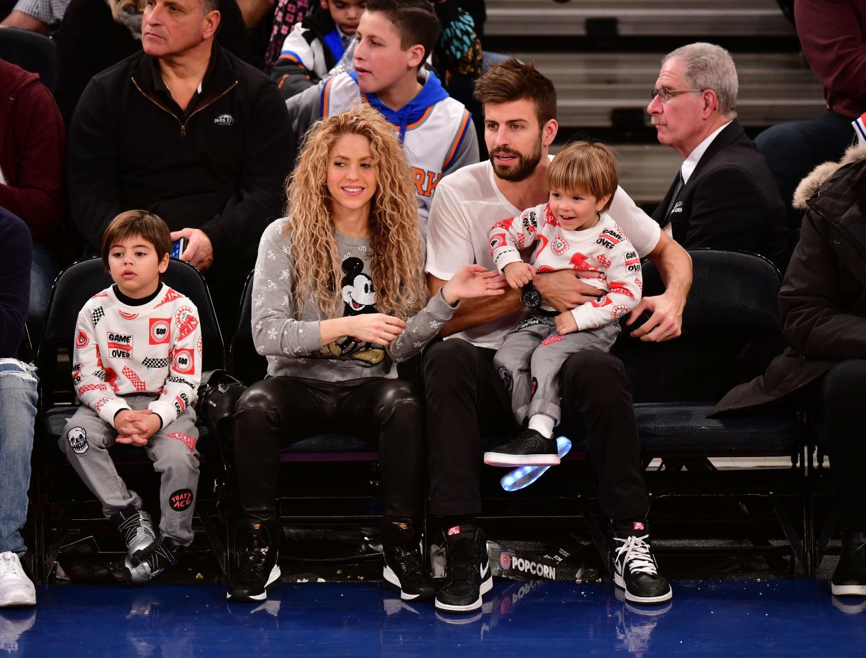 Shakira and boyfriend Gerard Piqu&eacute; took in the New York Knicks home basketball game with their two sons Christmas Day.
