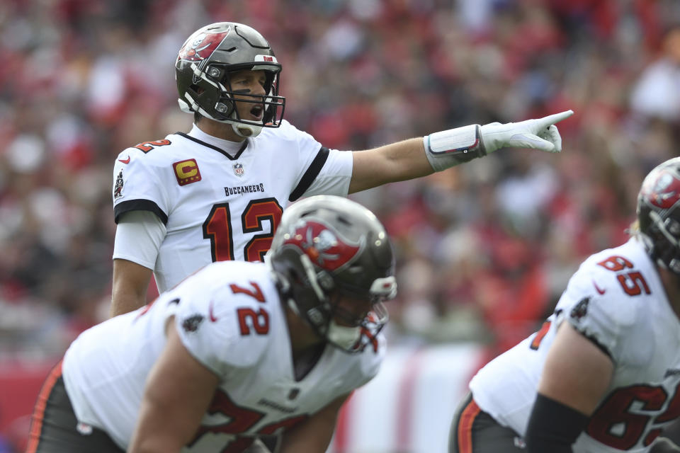 Tampa Bay Buccaneers quarterback Tom Brady (12) calls a play against the Philadelphia Eagles during the first half of an NFL wild-card football game Sunday, Jan. 16, 2022, in Tampa, Fla. (AP Photo/Jason Behnken)