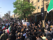 Mourners carry a casket during a mass funeral for those who died in a terror attack on a military parade in Iran in Ahvaz, Iran, Monday, Sept. 24, 2018. Iran on Monday held a mass funeral for those killed in the attack Saturday in the country's oil-rich southwest. (AP Photo/Ebrahim Noroozi)