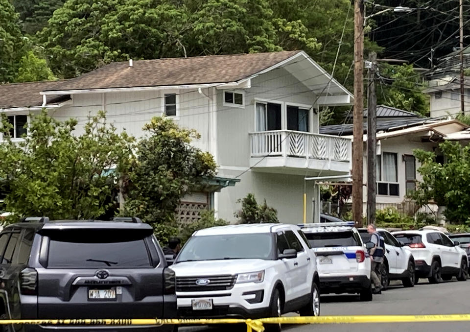 Honolulu police investigate the killings of multiple people at a home in Honolulu's Manoa neighborhood, Sunday, March 10, 2024. (Craig T. Kojima/Honolulu Star-Advertiser via AP)
