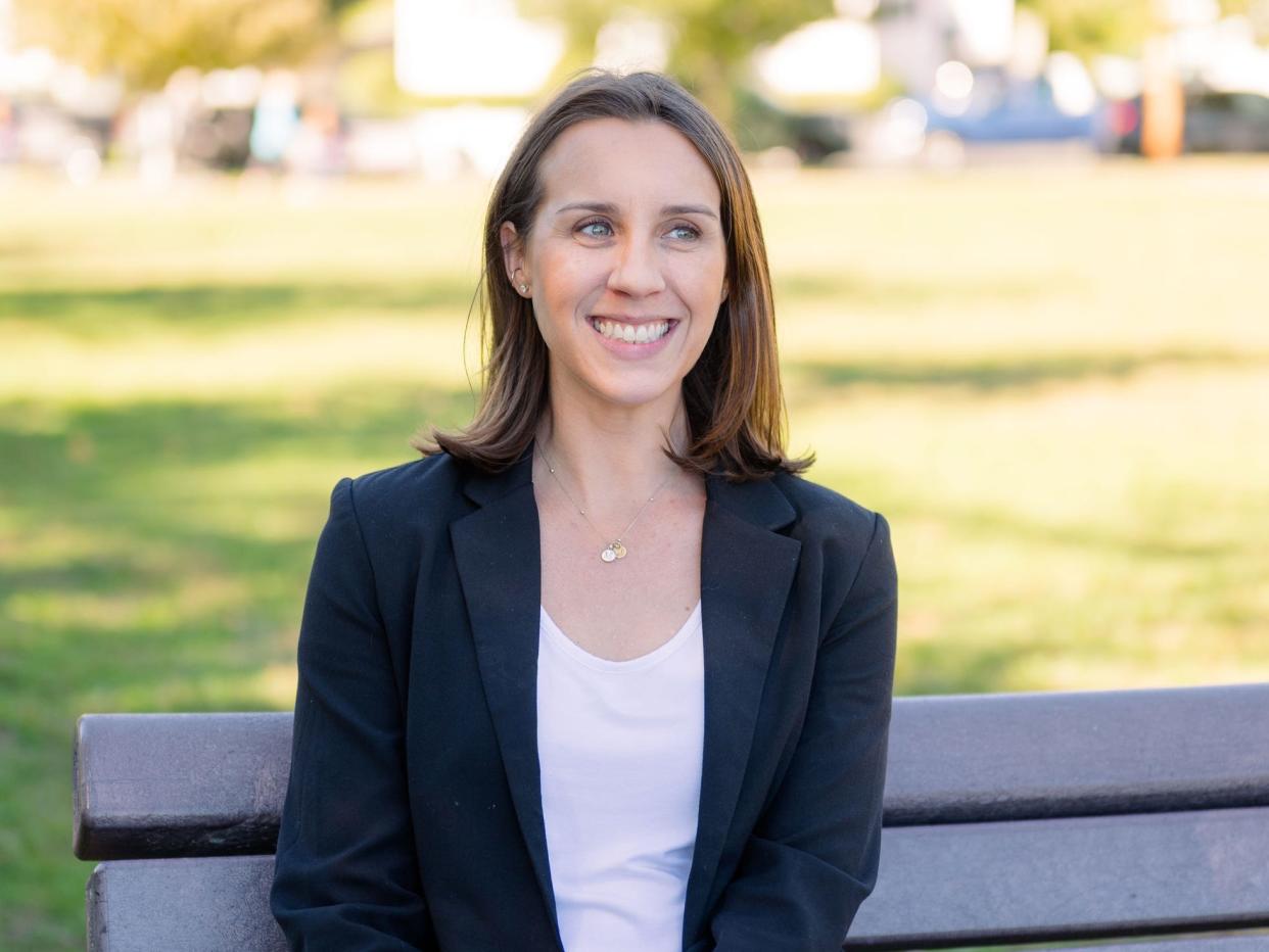 Dr. Isabelle Morley, a clinical psychologist, sitting on a park bench