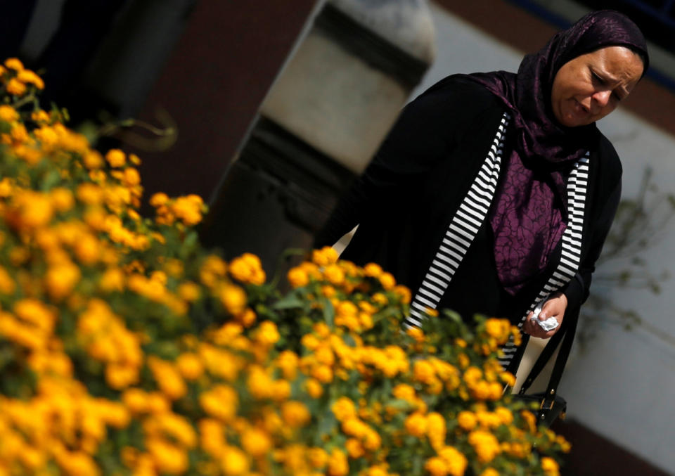 A relative of a crew member of an EgyptAir plane, which vanished from radar en route from Paris to Cairo, reacts as she arrives outside the EgyptAir in-flight service building, where relatives are being held, at Cairo International Airport, Egypt, May 19, 2016. (Reuters/Amr Abdallah Dalsh)