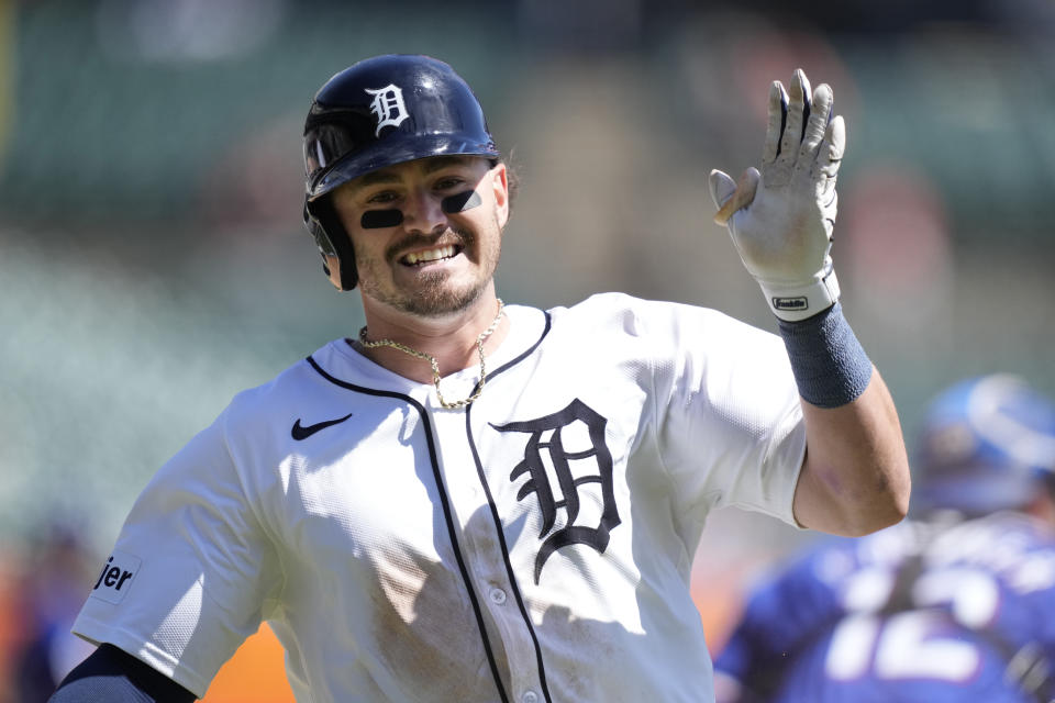 Detroit Tigers' Zach McKinstry crosses home plate to score during the sixth inning of a baseball game against the Texas Rangers, Tuesday, April 16, 2024, in Detroit. (AP Photo/Carlos Osorio)