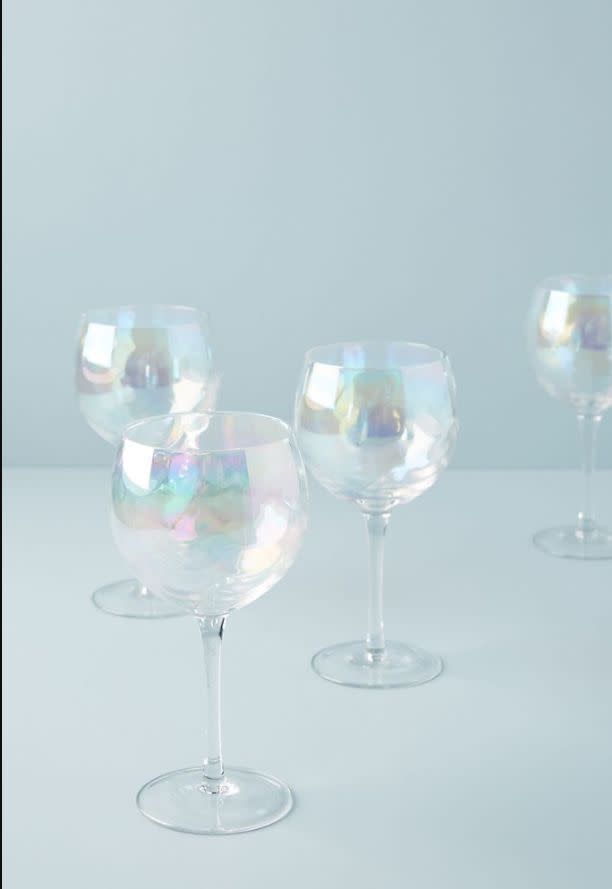 Find this <a href="https://fave.co/3mlTQZ8" target="_blank" rel="noopener noreferrer">Iridescent Wine Glasses for $40 </a>at Anthropologie.
