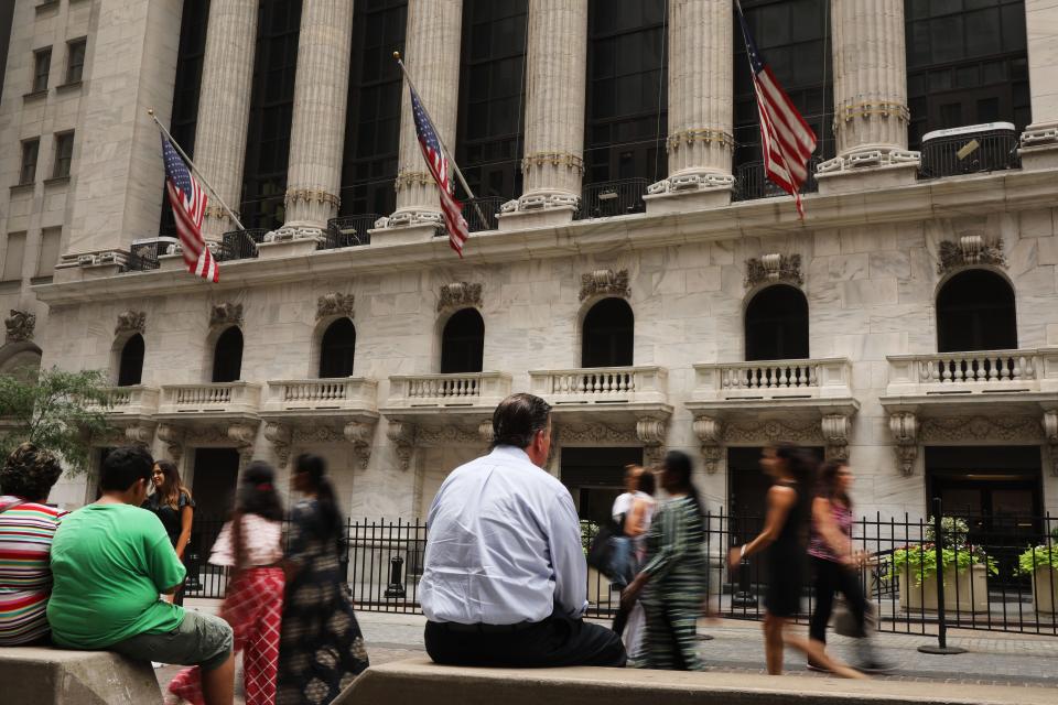 People walk by the New York Stock Exchange (NYSE) on August 14, 2019 in New York City. 56