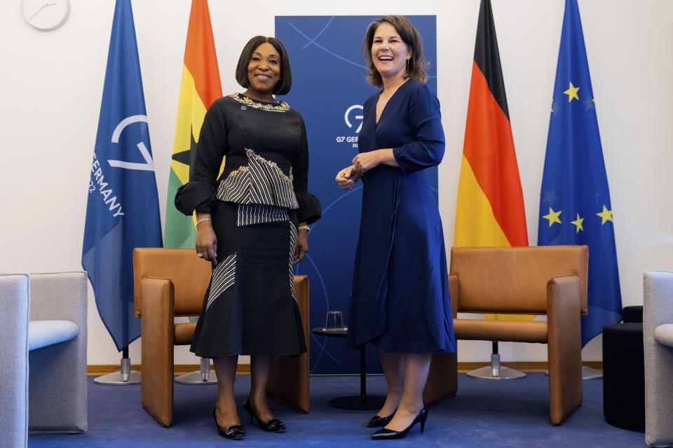 Foreign Minister of the Republic of Ghana, Shirley Ayorkor Botchwey, left, and German Foreign Minister Annalena Baerbock, right, shake hands during a meeting as part of the G7 Foreign Ministers Meeting in Muenster, Germany, Friday, Nov. 4, 2022. (Rolf Vennenbernd/DPA via AP, Pool)