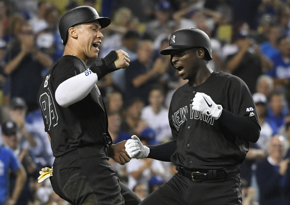 Aaron Judge #99 of the New York Yankees congratulates Didi Gregorius #18 after he hit a grand slam home run against Hyun-Jin Ryu #99 of the Los Angeles Dodgers (Photo by John McCoy/Getty Images)