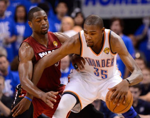 Oklahoma City Thunder's Kevin Durant (R) and Miami Heat's Dwyane Wade during game one of the NBA Finals on June 12. Durant scored 23 of his game-high 36 points in the second half