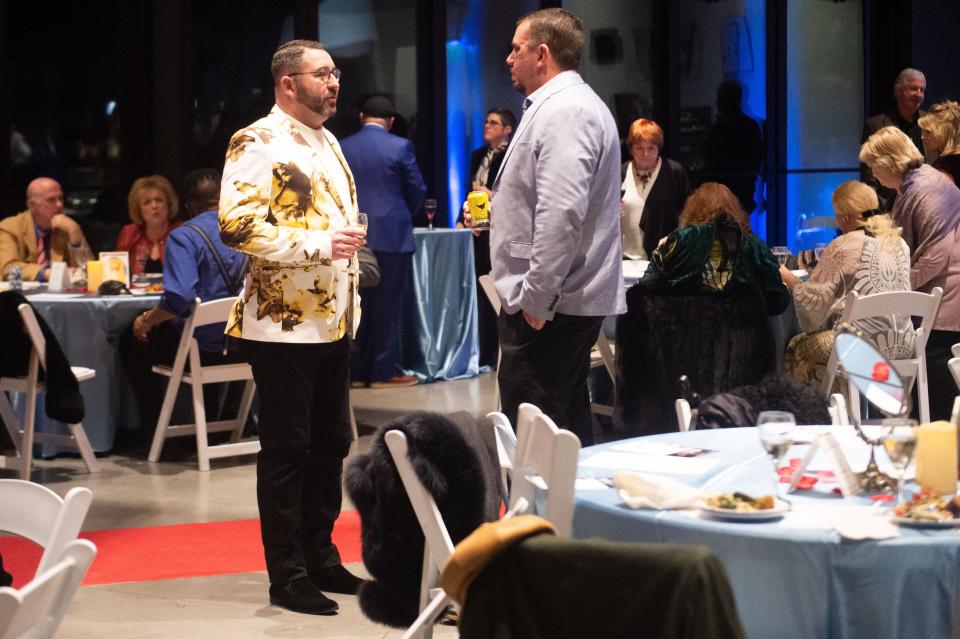 Attendees chat during the Marble City Opera's 10th Season Benefit at The Dogwood Center in Knoxville, Tenn. on Saturday, Jan. 14, 2023.