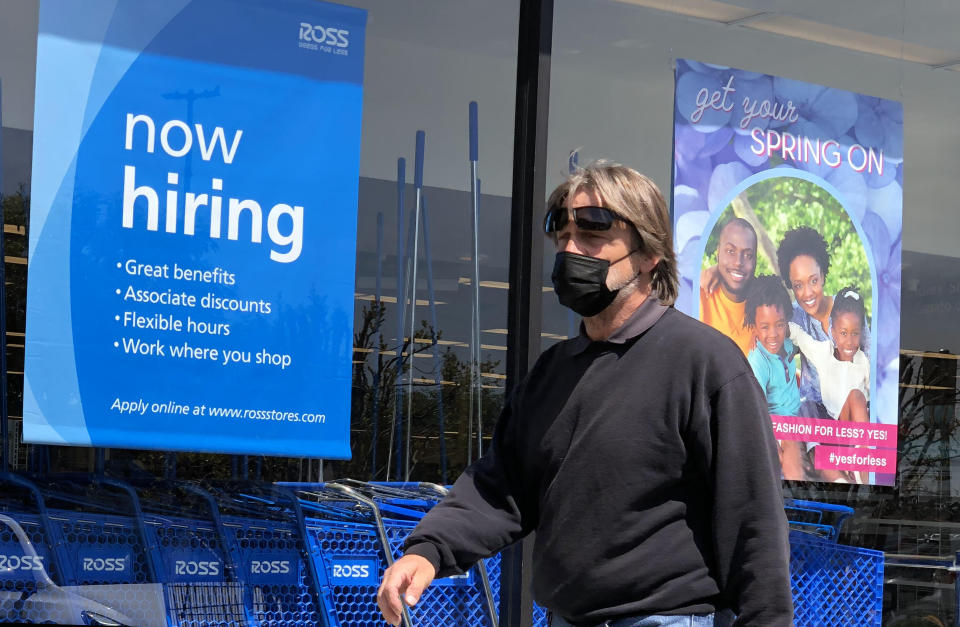 SAN RAFAEL, CALIFORNIA - APRIL 02: A pedestrian walks by a now hiring sign at Ross Dress For Less store on April 02, 2021 in San Rafael, California. According to a report by the Bureau of Labor Statistics, the U.S. economy added 916,000 jobs in March and the unemployment rate dropped to 6 percent. Leisure and hospitality jobs led the way with 280,000 new jobs followed by restaurants with 176,000 jobs and construction with 110,000 new positions. (Photo by Justin Sullivan/Getty Images)