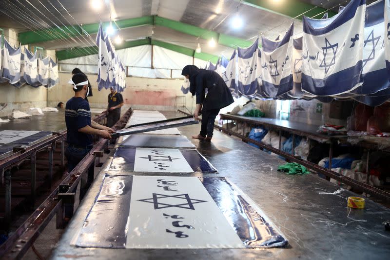 Large flag factory creates U.S. and Israeli flags for Iranian protesters to burn in Khomein City