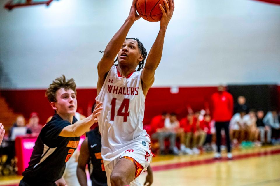 New Bedford's Damarius Roberts attacks the basket.