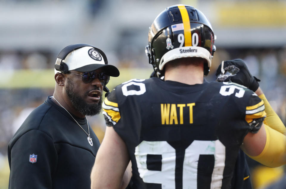 Nov 12, 2023; Pittsburgh, Pennsylvania, USA;  Pittsburgh Steelers head coach Mike Tomloin (left) reacts to linebacker T.J. Watt (90) on the sidelines against the Green Bay Packers during the fourth quarter at Acrisure Stadium. Pittsburgh won 23-19. Mandatory Credit: Charles LeClaire-USA TODAY Sports
