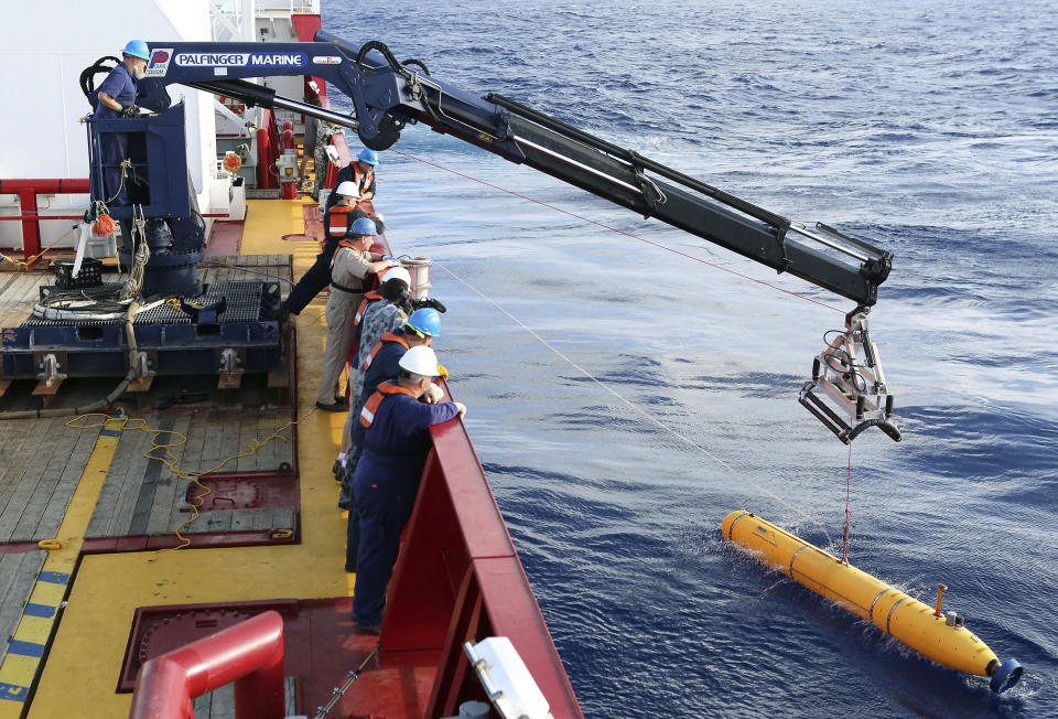 In this Monday, April 14, 2014, photo provided by the Australian Defense Force an autonomous underwater vehicle is deployed from ADV Ocean Shield in the search of the missing Malaysia Airlines Flight 370 in the southern Indian Ocean. The search area for the missing Malaysian jet has proved too deep for the robotic submarine which was hauled back to the surface of the Indian Ocean less than half way through its first seabed hunt for wreckage and the all-important black boxes, authorities said on Tuesday. (AP Photo/Australian Defense Force, Lt. Kelli Lunt) EDITORIAL USE ONLY