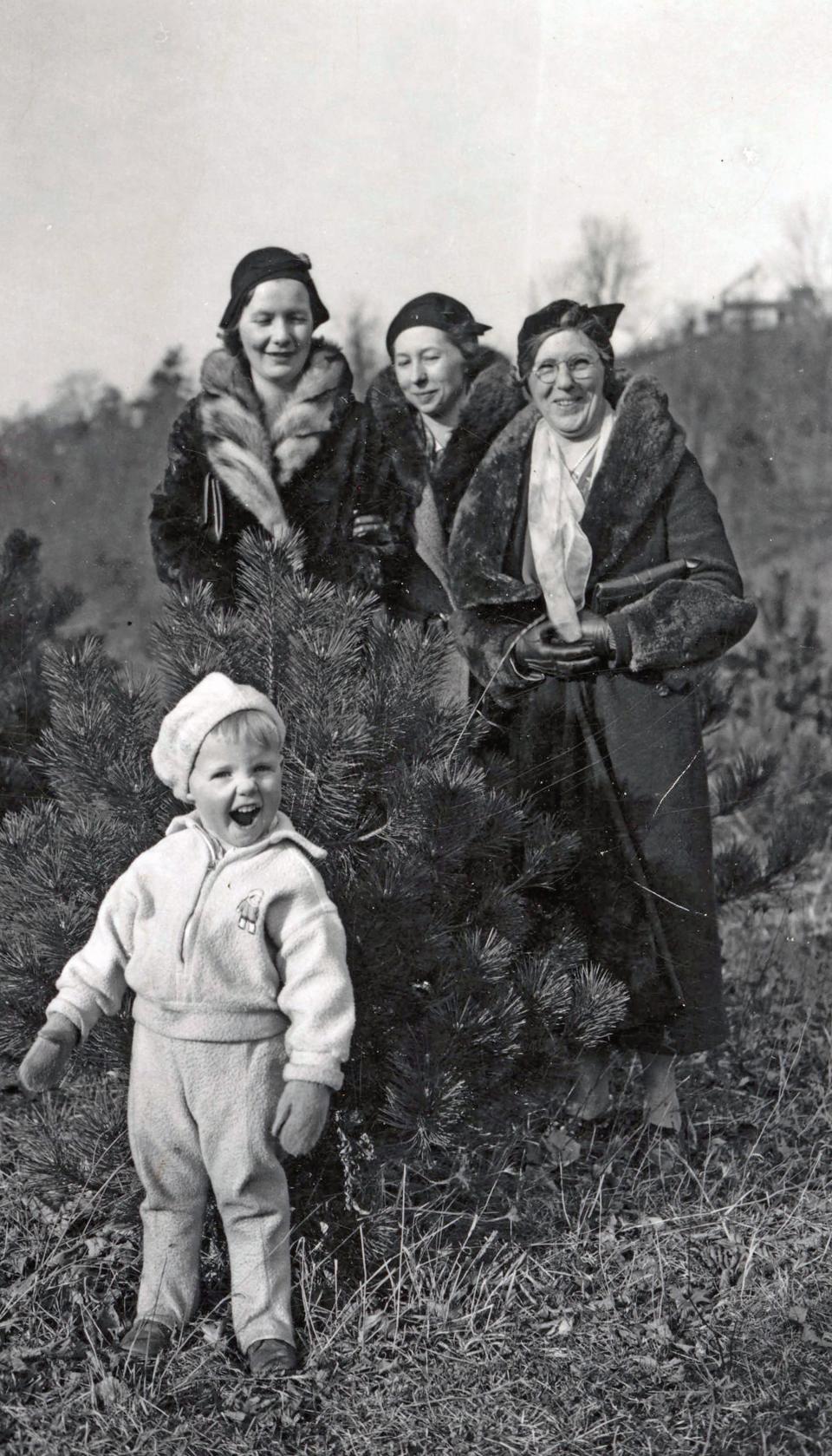 A young Neil Armstrong smiles on January 14, 1933, with his mother Viola, center, and two friends.