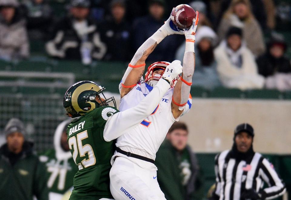 Nov 29, 2019; Fort Collins, CO, USA; Boise State Broncos wide receiver Khalil Shakir (2) pulls in a reception over Colorado State Rams cornerback Keevan Bailey (25) in the fourth quarter at Sonny Lubick Field at Canvas Stadium. Mandatory Credit: Ron Chenoy-USA TODAY Sports