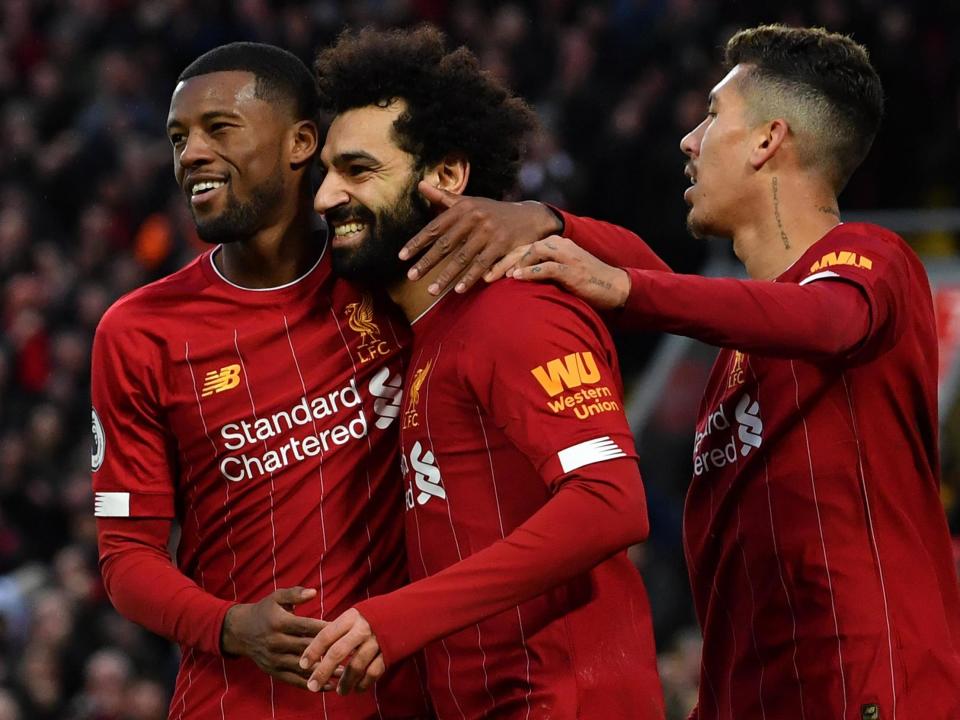 Liverpool's Mohamed Salah celebrates with teammates: AFP/Getty