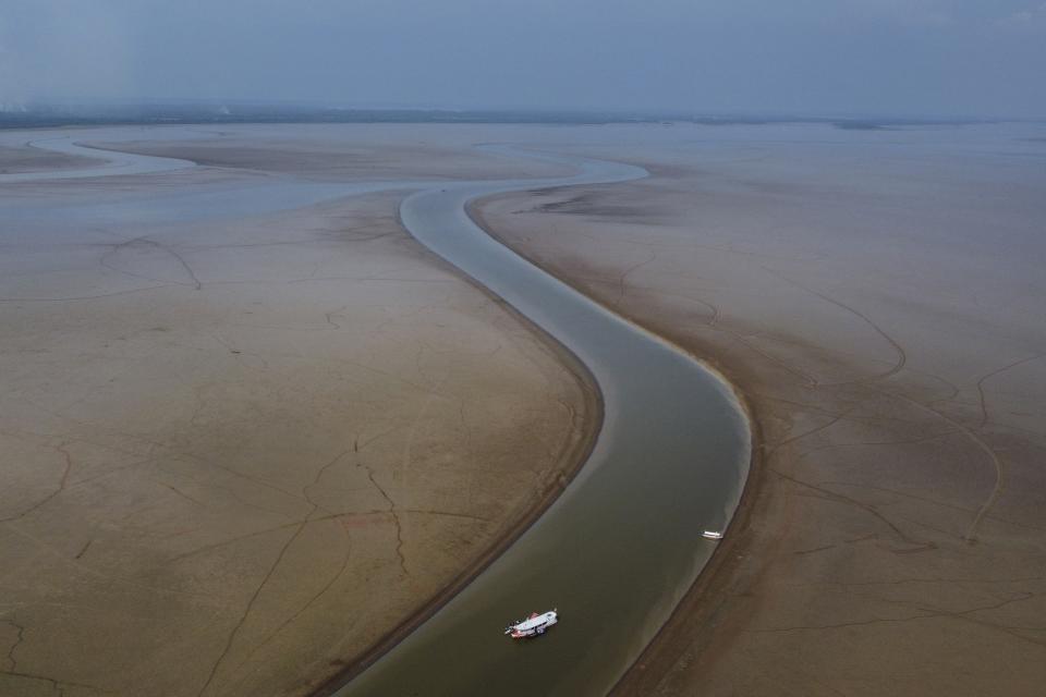 FILE - A boat travels through a section of the Amazon River impacted by drought in the state of Amazonas, near Manacapuru, Brazil, Sept. 27, 2023. Leaders from countries with large, forest-rich river basins are meeting in the Republic of Congo on Thursday, Oct. 26, to work together to protect the world's tropical forests from deforestation and destruction. (AP Photo/Edmar Barros, File)